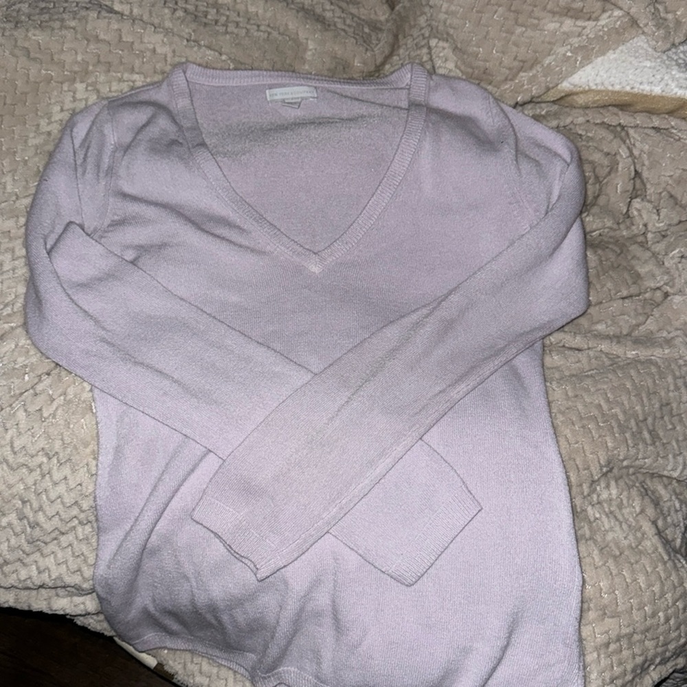 comfortable lilac sweater.